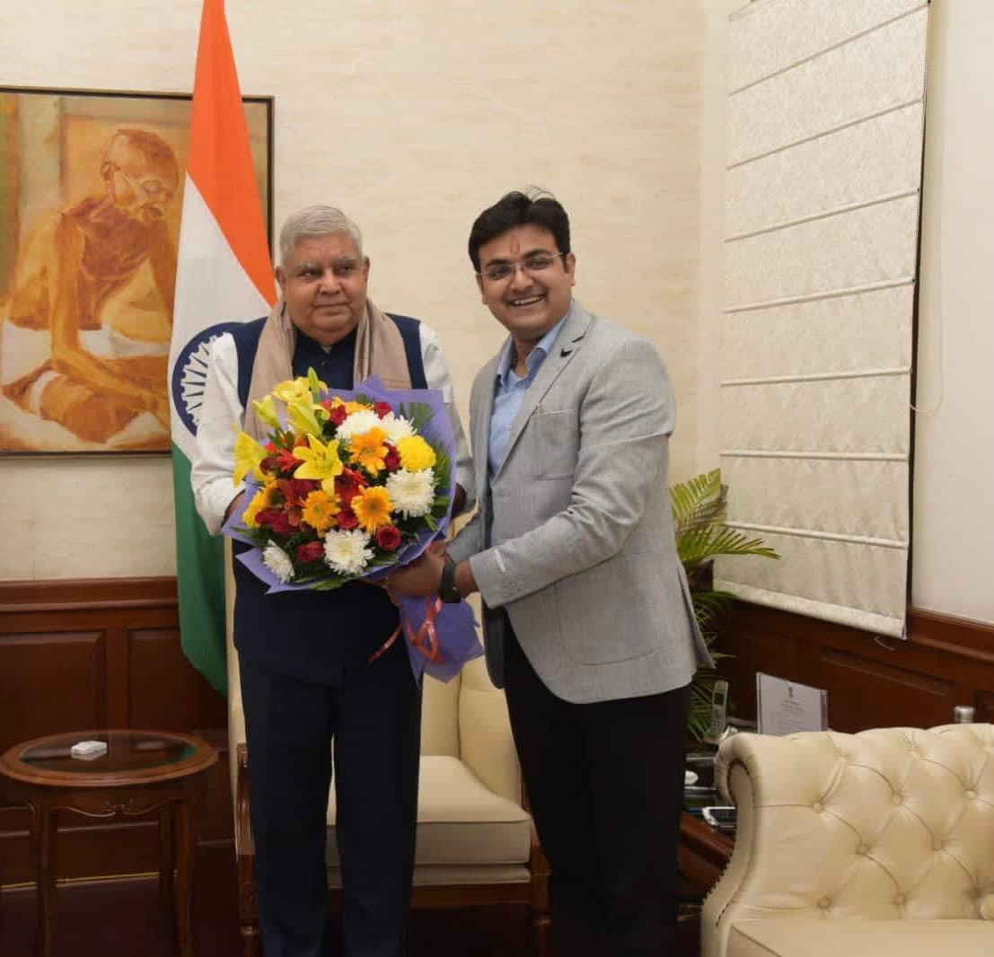 Presenting a bouquet to Honorable Vice president of India